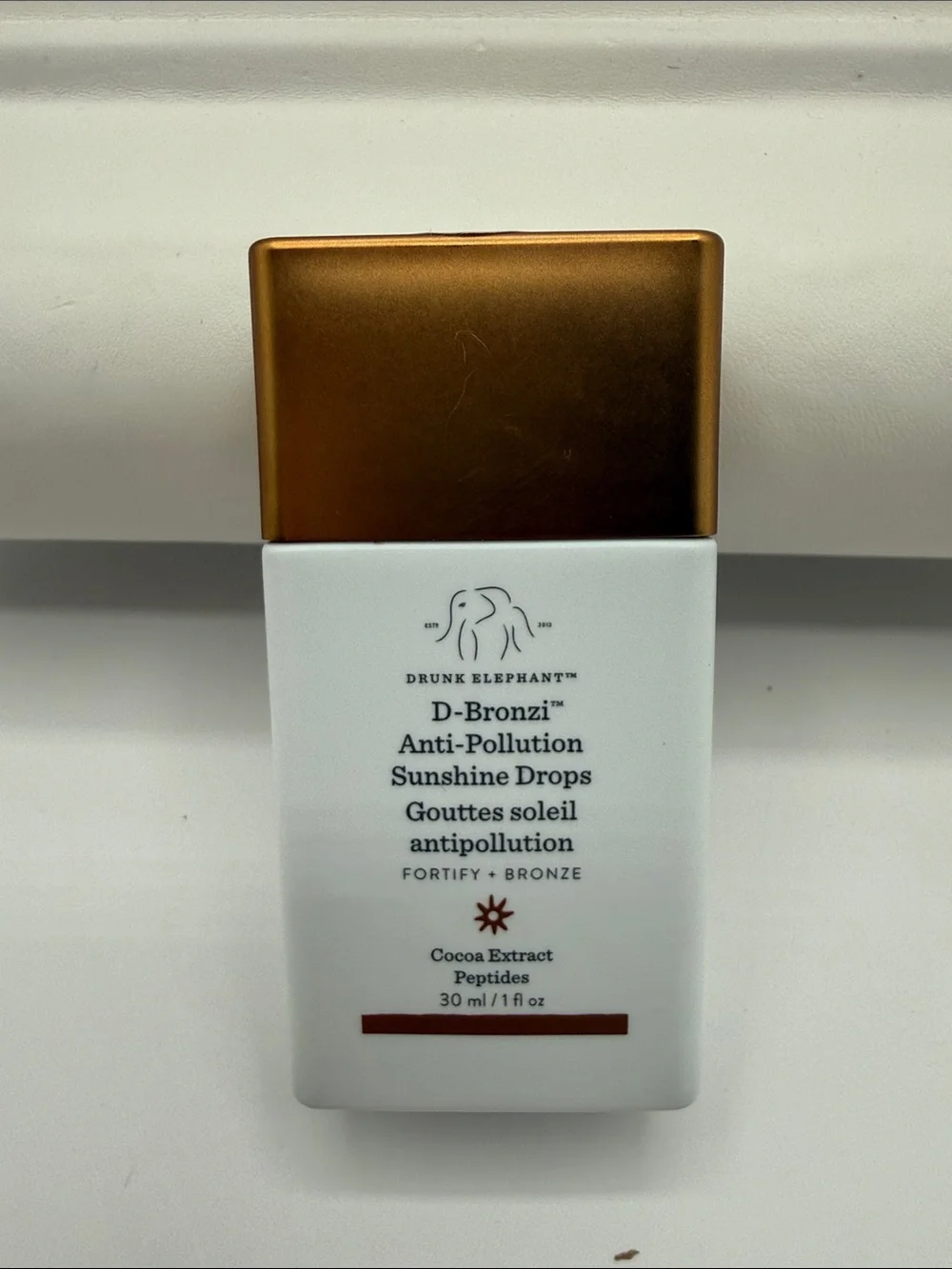 Drunk Elephant D-Bronzi Anti-Pollution Sunshine Drops — Bronze & White Bottle